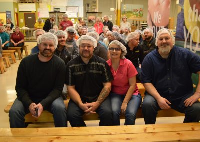 Crawford Roofing Employees volunteering with Feed My Starving Children Through Rabine Group Foundation